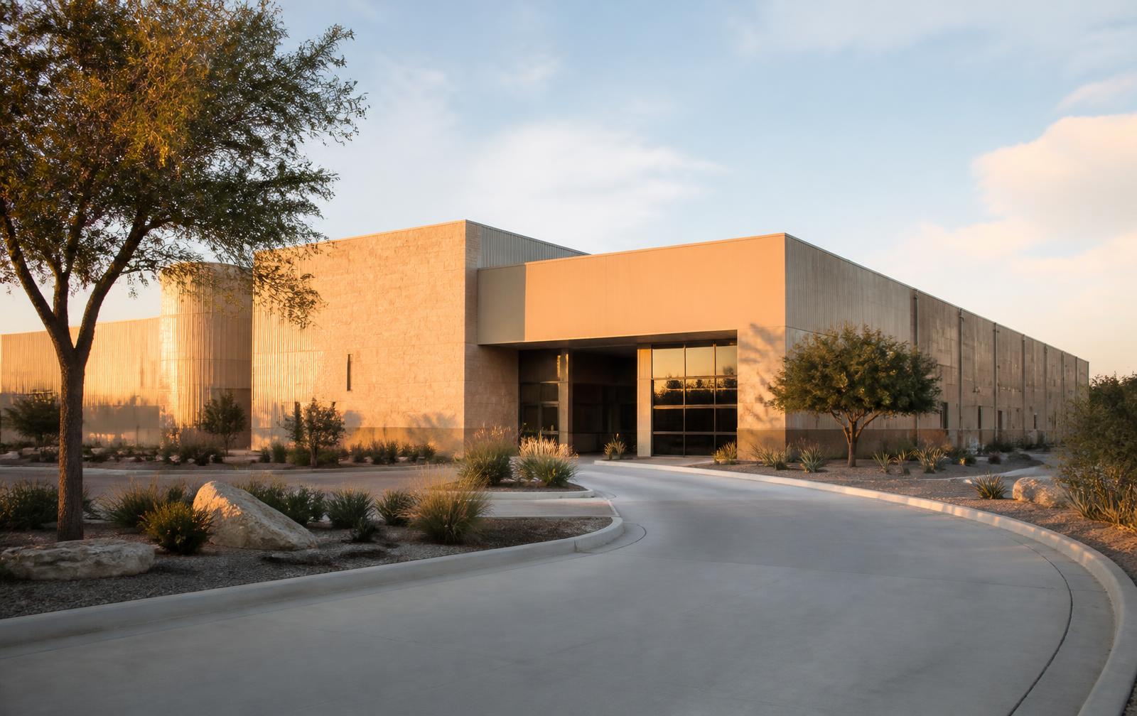J4 Biologics facility exterior at golden hour